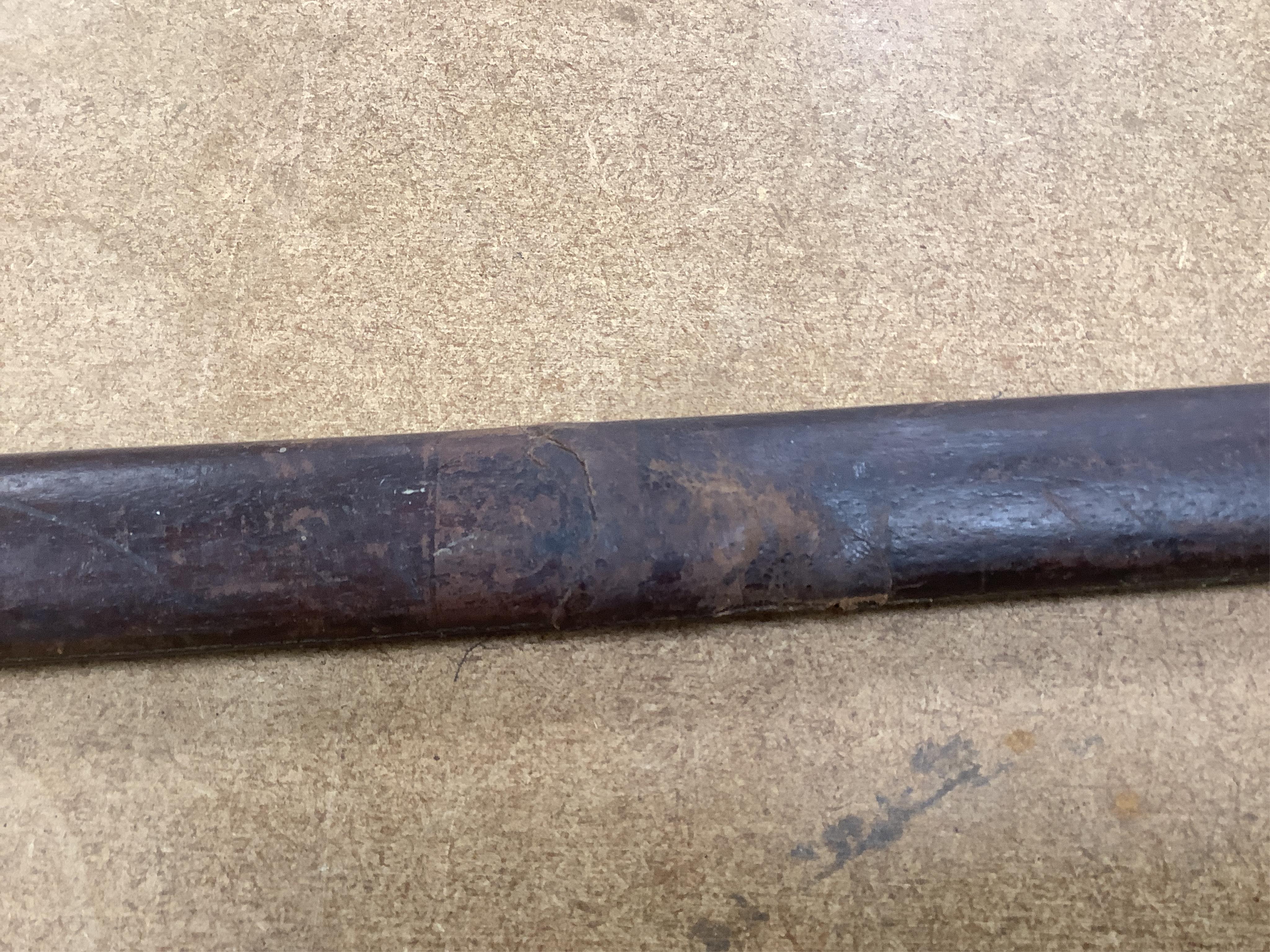 A late Victorian officer’s sword of the Black Watch, claymore blade etched with regimental title and VR cipher, regulation basket hilt, fish skin covered grip, in its leather covered field service scabbard, blade 82cm. C